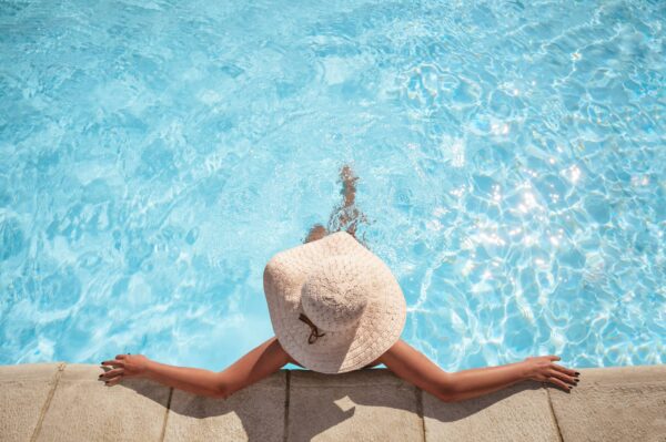 Young woman relaxing in the swimming pool with copy space Lymphedema