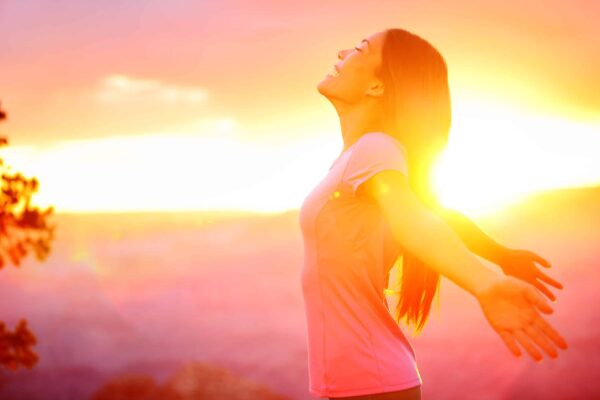 Free happy woman enjoying nature sunset get ready for summer after your mastectomy
